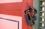 Old Rusty Lock On The Wooden Gate Stock Photo