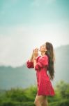 Beautiful Young Attractive  Asian Women In Red Dress On Sunrise Beautiful Nature Background Of The Mountains And Lotus Garden Image Of Happy  Camping, Travel, Lifestyle Resting , Relaxing Concept Vintage Style Stock Photo