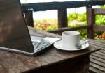 Coffee Cup And Laptop Stock Photo