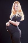 Pregnant Woman Holding Tummy Stock Photo