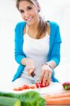 Pretty Young Woman Cooking At Home Stock Photo