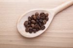 Coffee Beans In Spoon Stock Photo