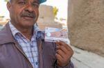 Egyptian Man Showing Entrance Ticket Stock Photo