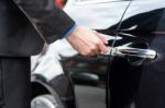 Man Inserting Car Key Into The Door Lock Stock Photo