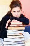 Student And Bunch Of Books At Home Stock Photo