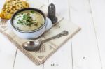 Mushroom Soup With A Bread Roll And Parsley Stock Photo