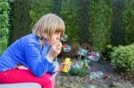 Young Girl Blowing Bubbles From Soapy Water Stock Photo