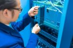 People Fix Node Fiber Optic In Network Room Stock Photo