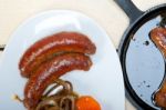 Beef Sausages Cooked On Iron Skillet Stock Photo