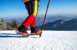 View Of Walking On Snow With Snow Shoes And Shoe Spikes In Winte Stock Photo