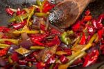 Fried Chili Pepper And Vegetable On A Wok Pan Stock Photo