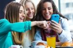 Friends Having Fun With Smartphones Stock Photo