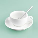 White Cup On Green Blue Background Solid Stock Photo