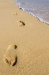 Footprints On The Shoreline Stock Photo