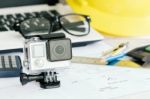 Extreme Sport Camera On Work Desk Stock Photo