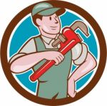 Plumber Pointing Monkey Wrench Circle Cartoon Stock Photo