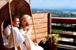 Loving Couple Sitting On Swing Stock Photo