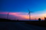 Wind Turbine With The Silhouette At Sky Stock Photo