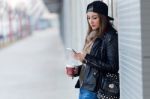 Young Beautiful Woman With Mobile Phone And Coffee Stock Photo