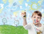 Young Child Drawing A Landscape Stock Photo