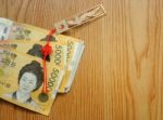 Korean Money With Good Luck Charm Stock Photo