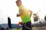 Handsome Young Man Running In The Park Stock Photo