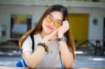 Portrait Of Thai Chinese Adult Glasses Beautiful Girl Denim Blue Bag Relax And Smile Stock Photo