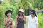 Portrait Of Asian Woman Friend Group Walking In Green Park And T Stock Photo