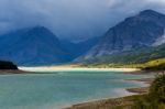 Storm Clouds Gathering Over Lake Sherburne Stock Photo