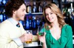 Let's Celebrate. Young Couple At Nightclub Stock Photo