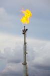 Flare Stack At Oil And Gas Refinery Plant Stock Photo