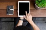 Close Up Of Mans Hands Using Tablet On Counter, Image Taken From Stock Photo