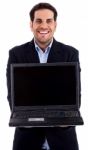 Man Showing Laptop Stock Photo