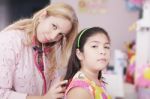 Pediatrician Examining Child Stock Photo