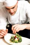 Cook Decorating A Broccoli Salad Stock Photo