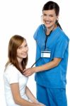 Friendly Doctor Examining Her Patient Stock Photo