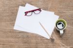 Blank Paper With Pencil A Cup Of Coffee And Eye Glasses Stock Photo