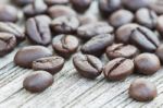 Closeup Coffee Beans On Wood Background Stock Photo