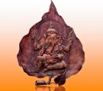 The Carving Wood Of Ganesha On Reflect Background Stock Photo