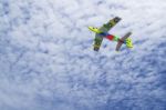 Colorful Toy Plane Against Blue Sky Stock Photo