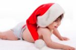 Santa Baby Trying To Crawl Stock Photo