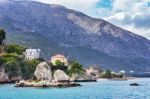 Houses Rocks And Mountain At Greek Sea Stock Photo