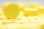 Pharmacy Theme, Heap Of Yellow Round Medicine Tablet Antibiotic Pills. Shallow Dof Stock Photo