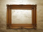 Old Picture Frame On Gold Wall Stock Photo