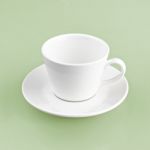 White Cup On Green Yellow Background Solid Stock Photo