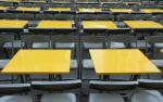 Rows Of Yellow Metal Tables And Chairs Stock Photo