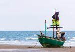 Fishing Boat On The Beach Stock Photo