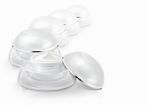 Several White Rounded Cosmetic Jar On White Background Stock Photo