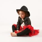 Little Girl Fashion Model With Black Hat Stock Photo