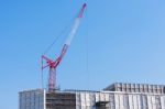 Red Construction Cranes In Japan Stock Photo